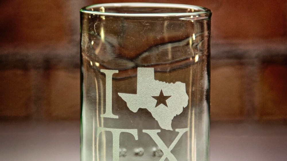 custom glass from A Second Round in Montgomery with I love Texas engraved on it