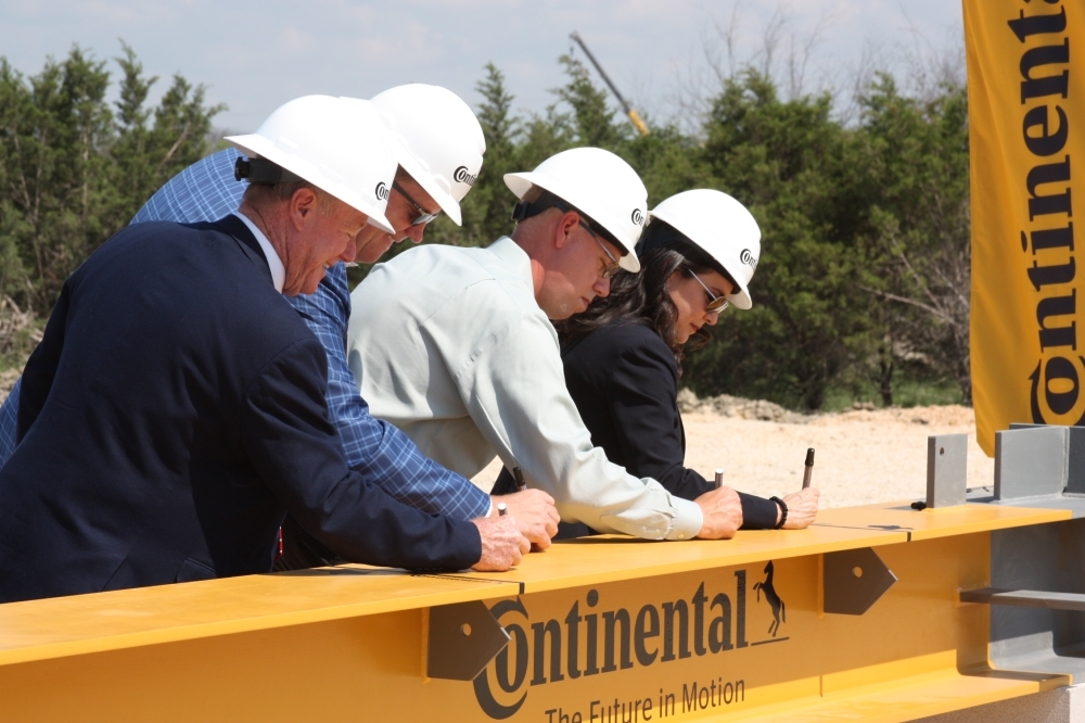 Representatives from Continental and the City of New Braunfels signed a beam that will be used in the construction of the facility. (Lauren Canterberry/Community Impact Newspaper)