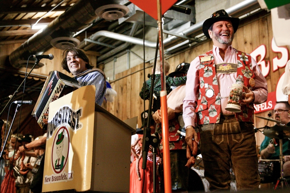 From left: Alex Meixner and Miles Granzin celebrate during the Nov. 5 opening ceremony for Wurstfest. (Photos by Lauren Canterberry/Community Impact Newspaper)