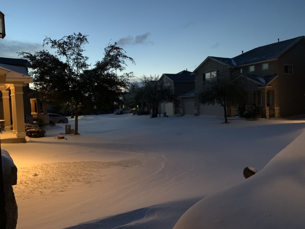 The sunrise Feb. 15 revealed unusual amounts of snow had fallen overnight in western Travis County due to Winter Storm Uri. (Community Impact Newspaper file photo)