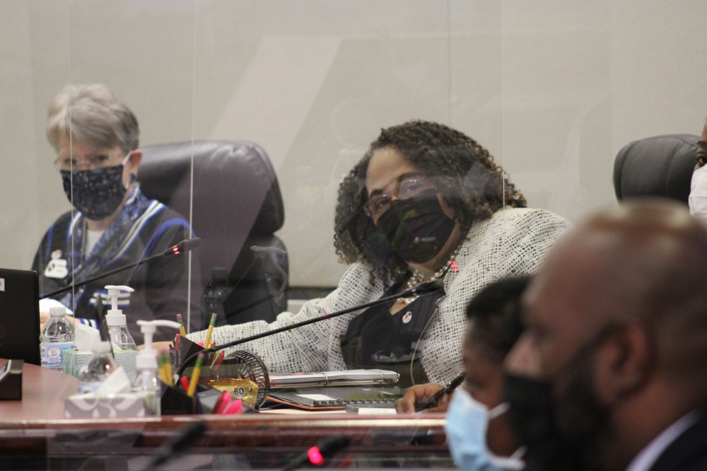 Spring ISD board President Justine Durant (right) and trustee Deborah Jensen (left) don masks during a November board meeting. (Emily Lincke/Community Impact Newspaper)