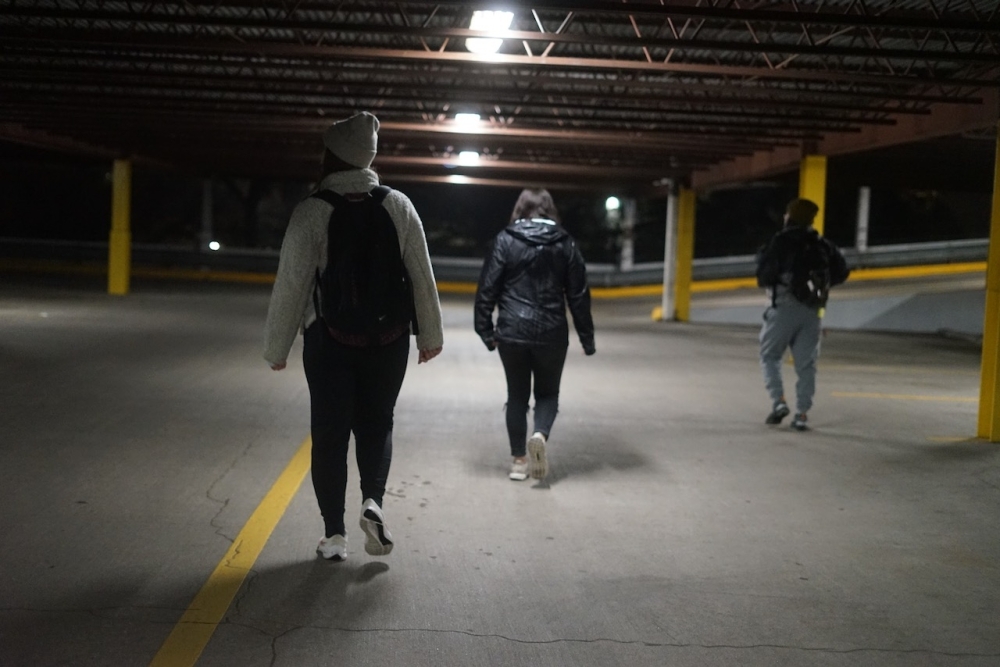 Throughout the night, volunteers traversed sidewalks, parking garages and alleyways in an effort to count as many people as possible. (Katy Mcafee/Community Impact)