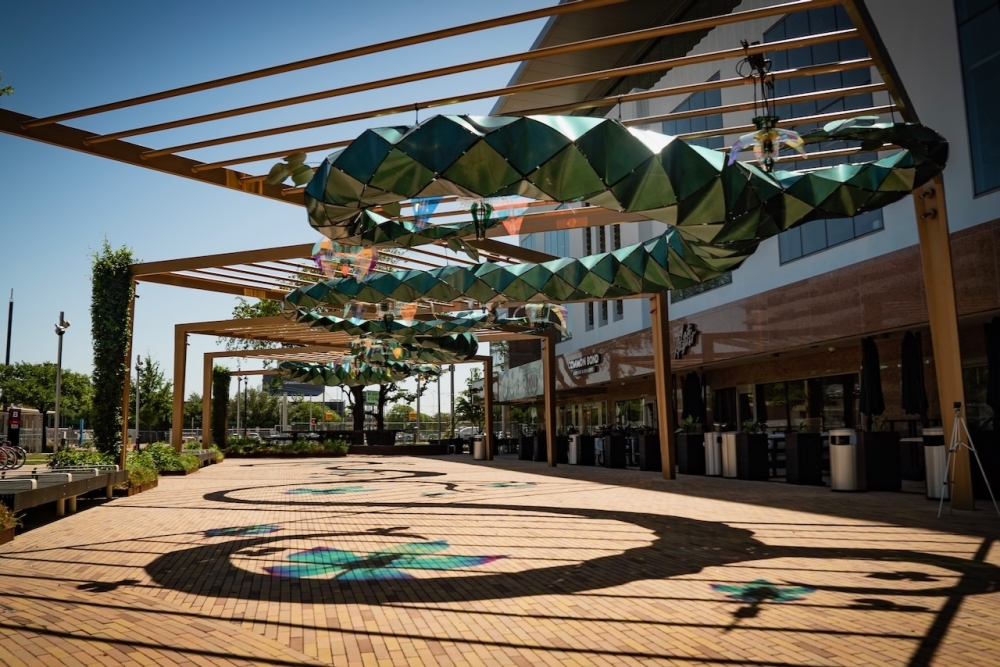 Efflorescence is made of a snaking-vine structure that is made of a 3/16' twisted rod filled with metallic-green mica-painted plastic. (Courtesy Marc Furi Creative)