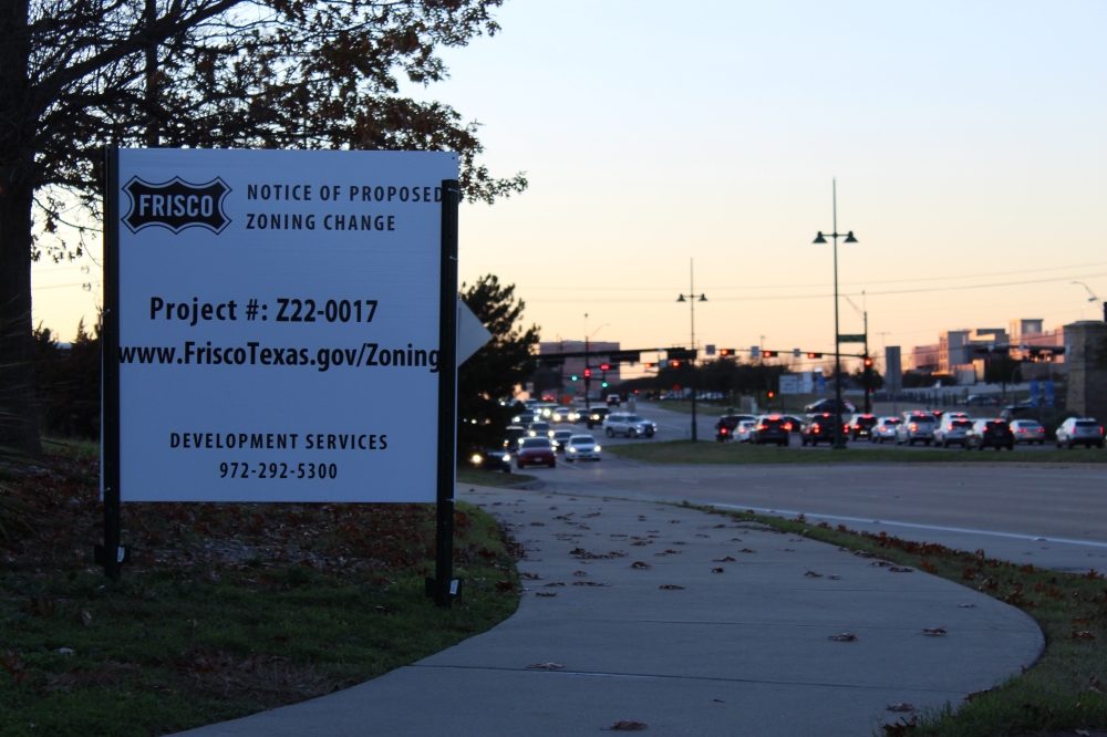 An example of a zoning sign from 2022, alerting residents to a 36.2-acre rezoning of Warren Parkway and Dallas Parkway. (Colby Farr/Community Impact)