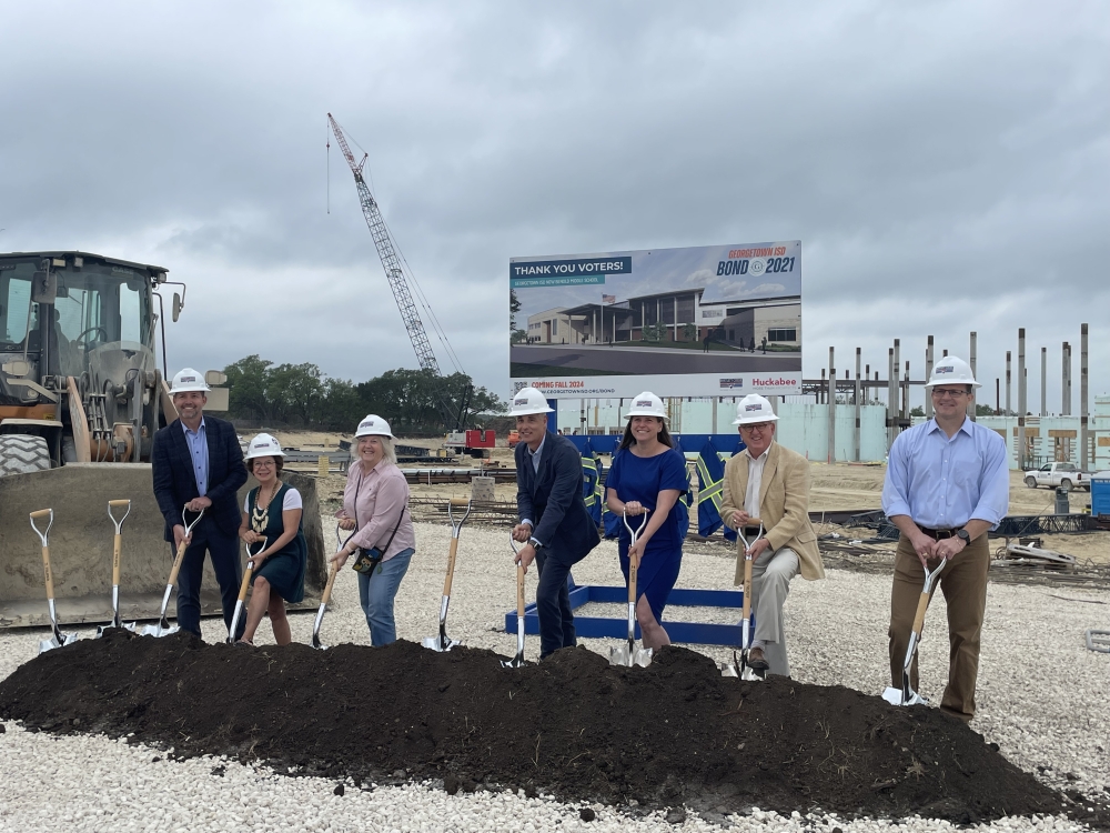 Members of the Georgetown ISD board of trustees, including Dr. Stephen Benold (second from the right) as well as Superintendent Fred Brent (right) and Georgetown Mayor Josh Schroeder (middle), participated in the groundbreaking. (Claire Shoop/Community Impact)