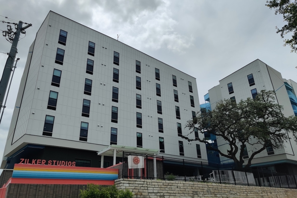 Zilker Studios from Foundation Communities features far less parking than standard apartment complexes given relaxed rules under Austin's Affordability Unlocked program. (Ben Thompson/Community Impact)
