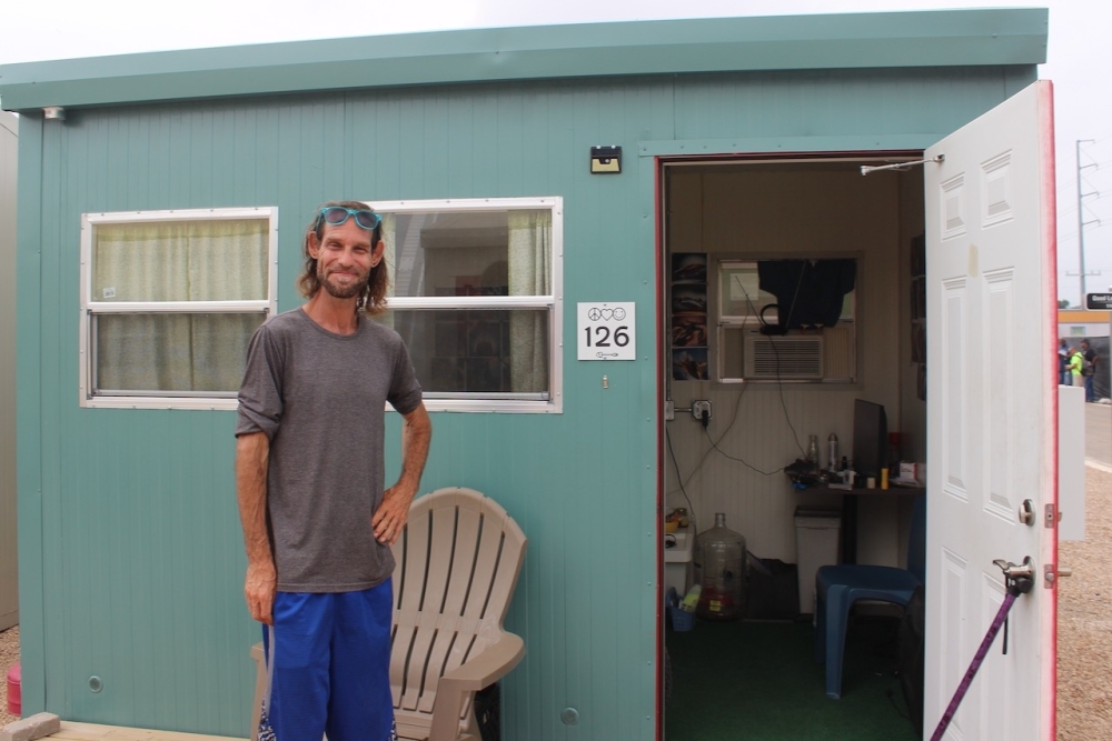 Angelo Diaz said he has felt safer and been able to focus on other aspects of his life since moving into his cabin at the Esperanza Community. (Ben Thompson/Community Impact)