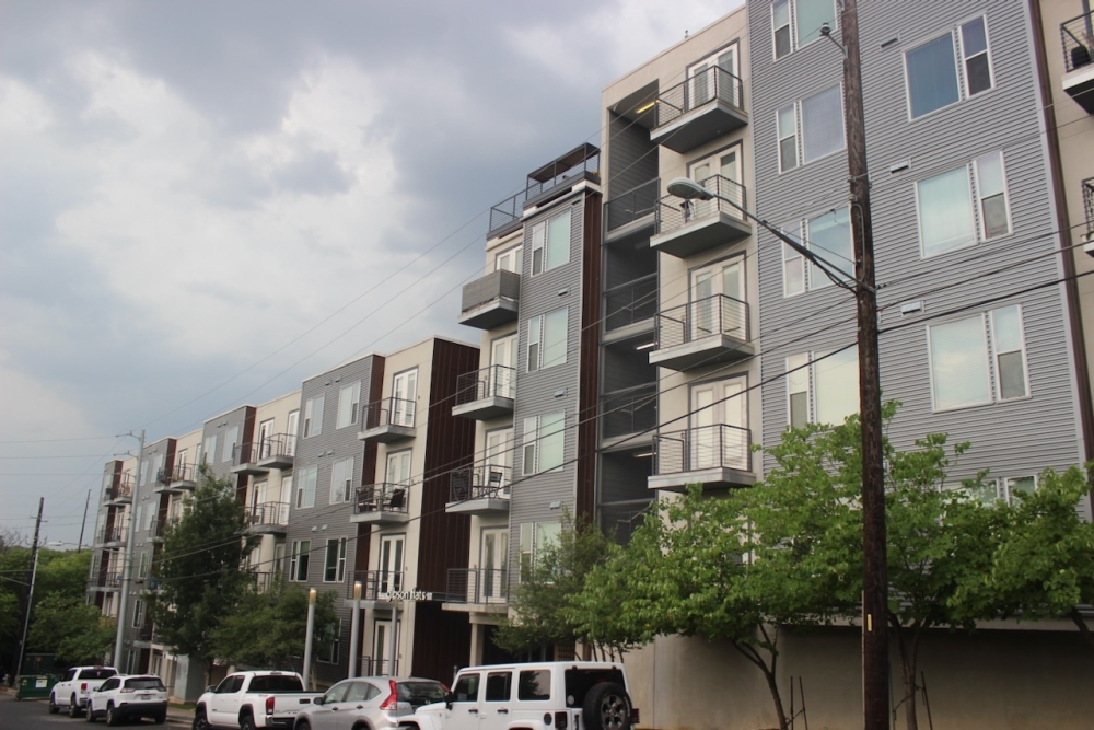 Despite being located on South Lamar Boulevard, the Gibson Flats apartment complex's height was limited by homes located across a railroad track and greenbelt to the east. (Ben Thompson/Community Impact)