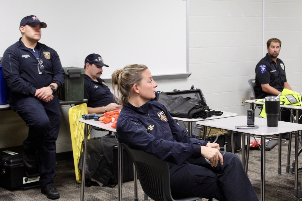 Cy-Fair Fire Department and Cy-Fair ISD Police Department staff debrief active-shooter response training efforts from earlier in the day. (Danica Lloyd/Community Impact)