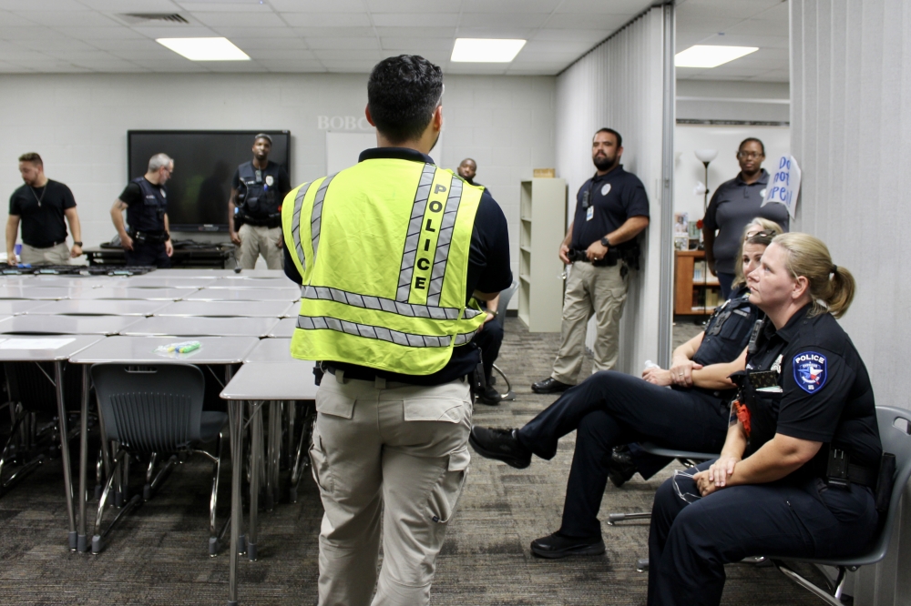 Training from the Advanced Law Enforcement Rapid Response Training Center includes a classroom portion as well as interactive active shooter response training exercises. First responders discuss what worked well and what could have gone better after each exercise. (Danica Lloyd/Community Impact)