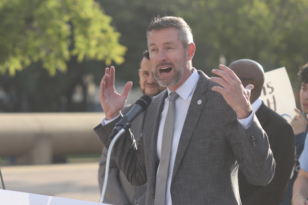 District 1 Council Member Chad West speaks at a rally for affordable housing Sept. 20 at City Hall. (Cecilia Lenzen/Community Impact)