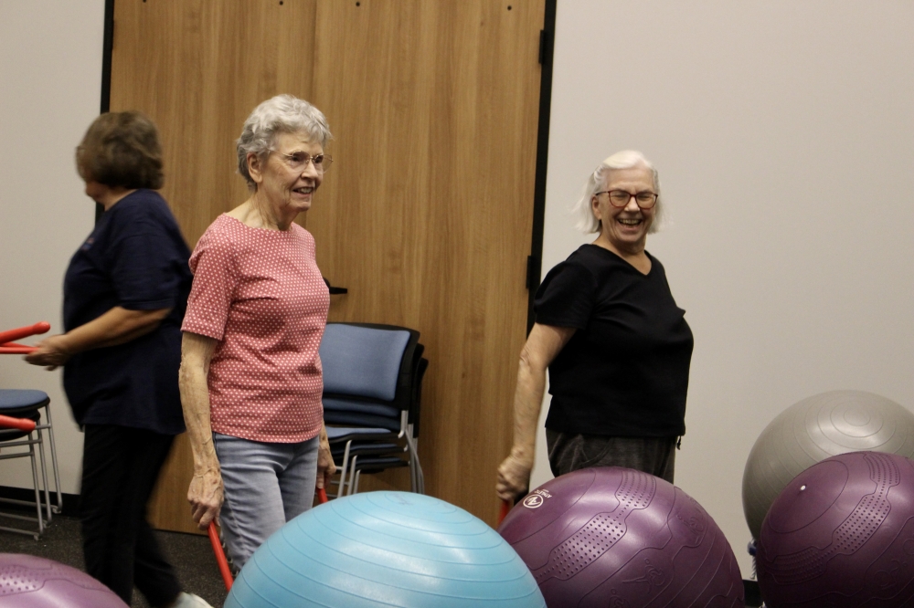 Two senior center members attend a 'drumba' class, a workout using dance steps and drumming, in the new Ralph O'Dell Senior Center, a facility more than double the size of Celina's downtown senior center. (Alex Reece/Community Impact)