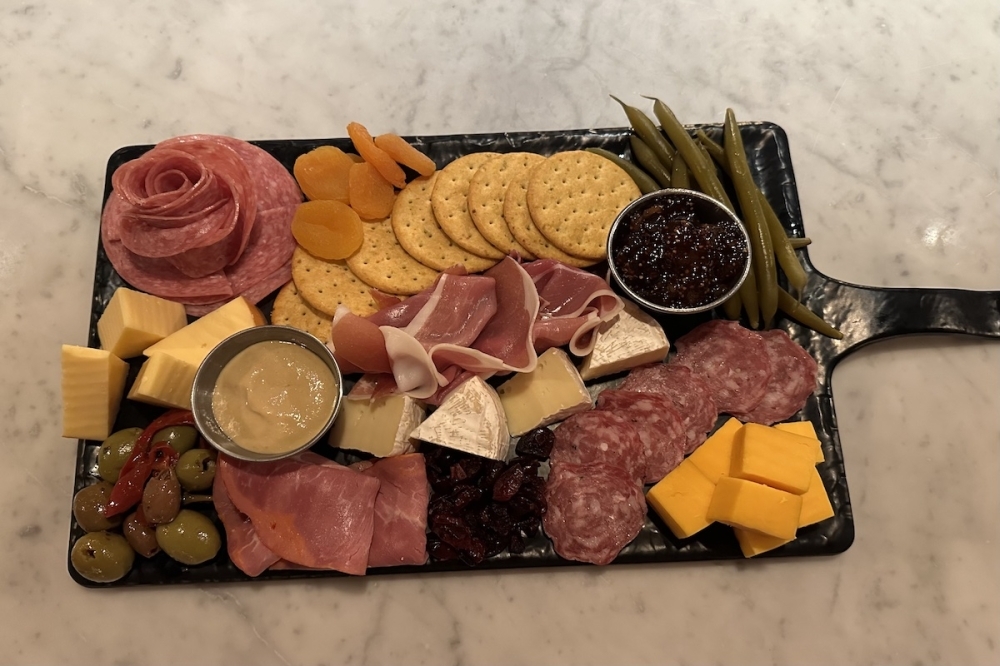Sidecar offers a charcuterie board, which has a variety of cheeses and meats. (Amira Van Leeuwen/Community Impact)
