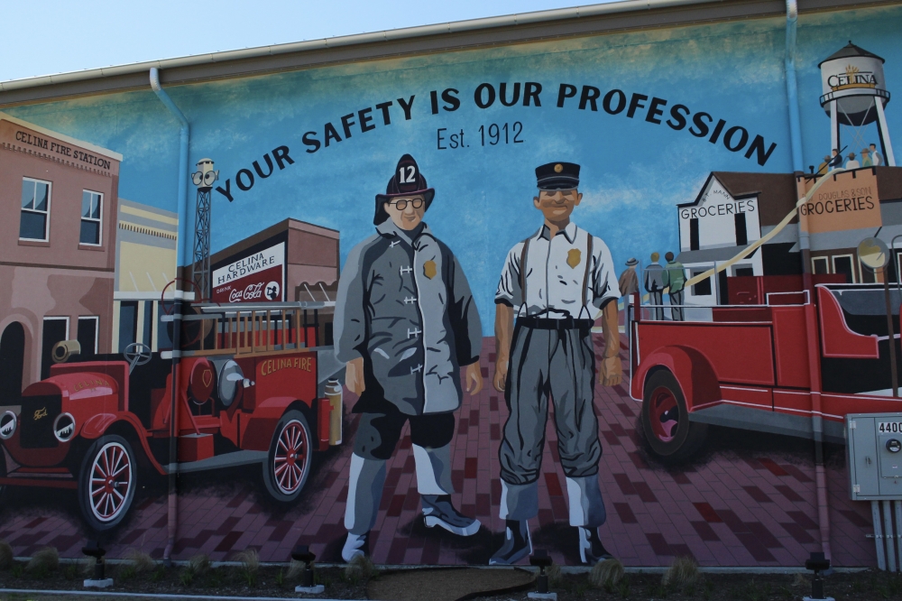 The mural, which was painted by artist Odessa Helm, depicts the Celina Fire Department's first fire chief, current Fire Chief Mark Metdker said. (Alex Reece/Community Impact)