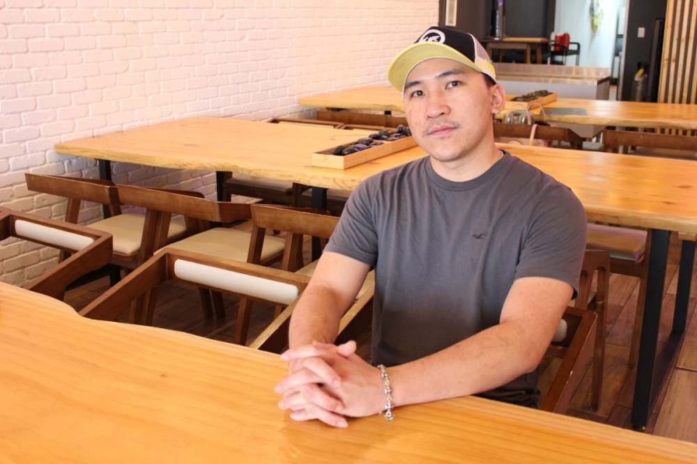 Andy Pham supplants Houston's diversity into the new location of Wrap & Roll's menu, he said. (Asia Armour/Community Impact)