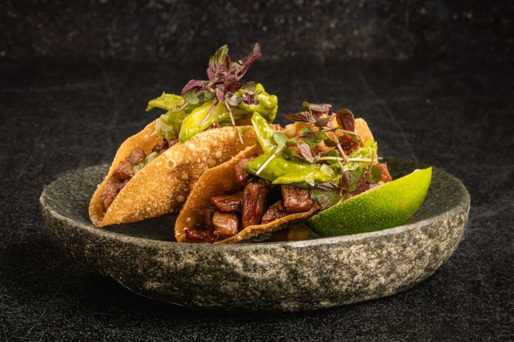 Toca Madera's A5 wagyu tacos are served in crispy wontons and have a jalapeno slaw, pickled horseradish, cilantro and kizami wasabi. (Courtesy Alonso Parra)