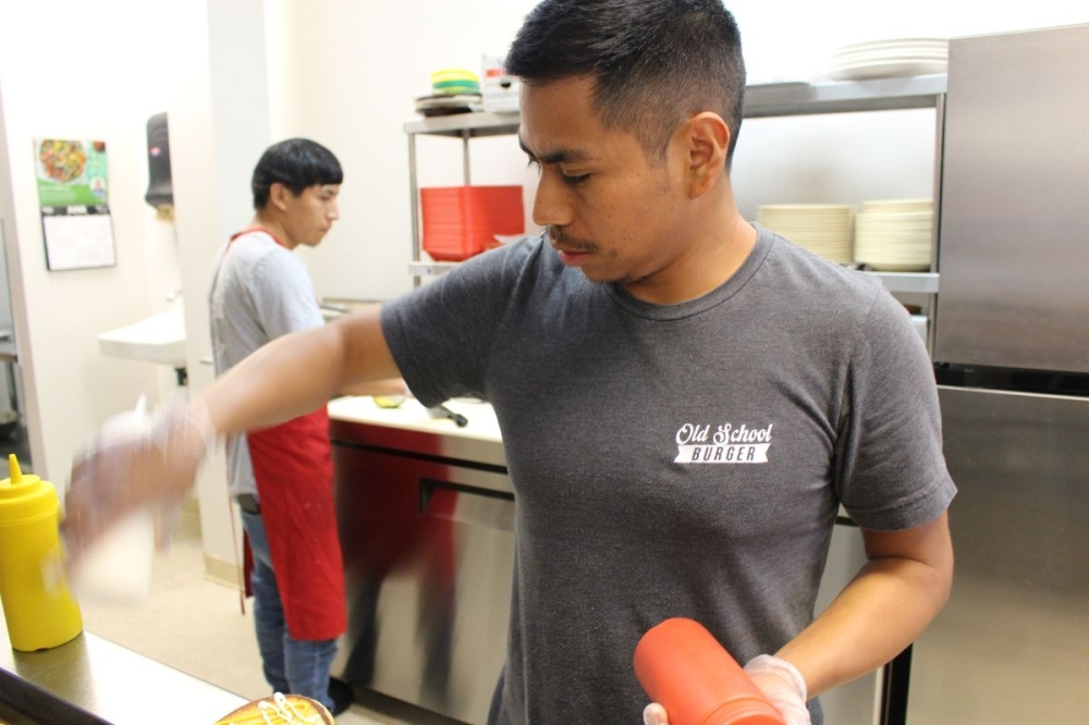 Tzep has spent more than a decade learning the food industry and the palate of Katy residents, which he said is the experience he brings to Old School Burger. (Asia Armour/Community Impact)