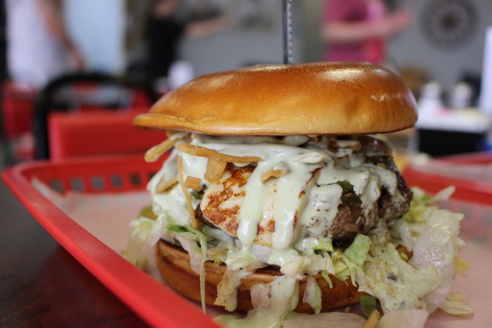 The newly introduced 'alamo' burger ($16.99) features chorizo, Carolina cheese, crispy onion strings and a Chipotle aoili. (Asia Armour/Community Impact)