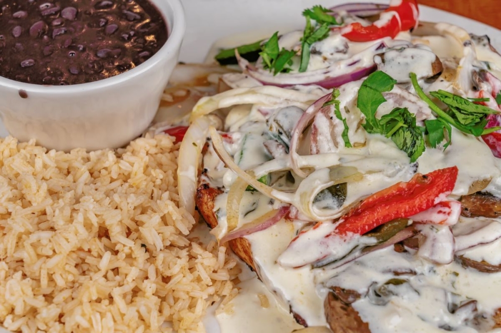 The Pollo Berryhill plate ($16.37) features grilled chicken with vegetables covered in a light cream sauce. (Courtesy Berryhill Baja Grill Sugar Land)