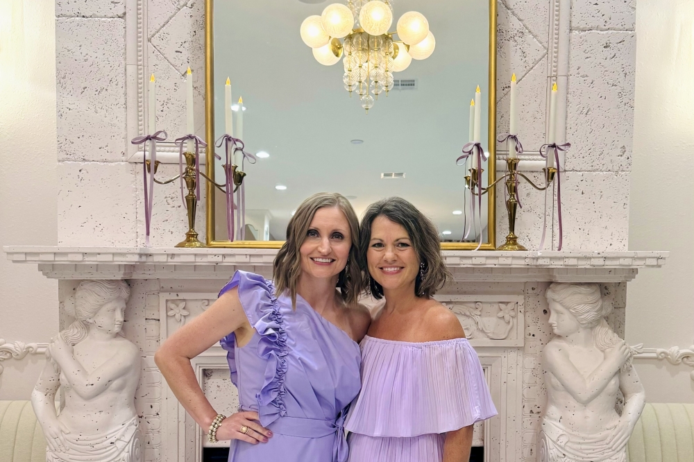 Sisters-in-law Jenna and Kari Whittington pose in their new business location. (Courtesy Whittington Bridal)