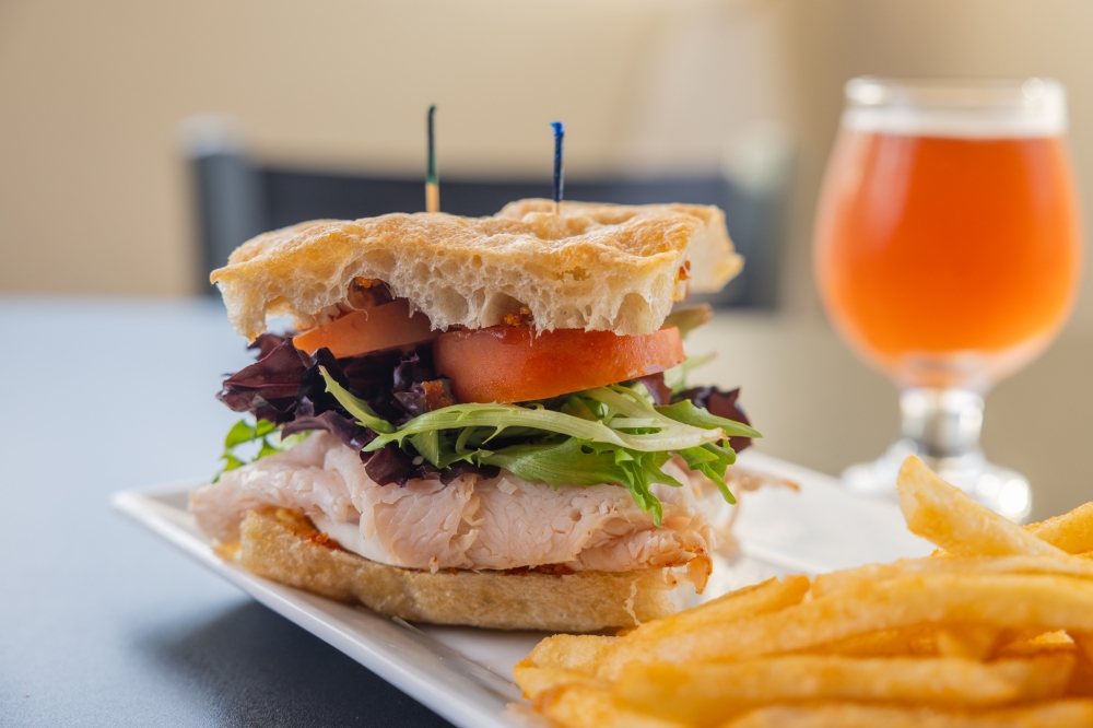 The smoked turkey sandwich is made with focaccia from The Bearded Baking Company, and comes with mozzarella, field greens, sundried tomato pesto and Roma tomatoes. (Courtesy Stem & Stone)