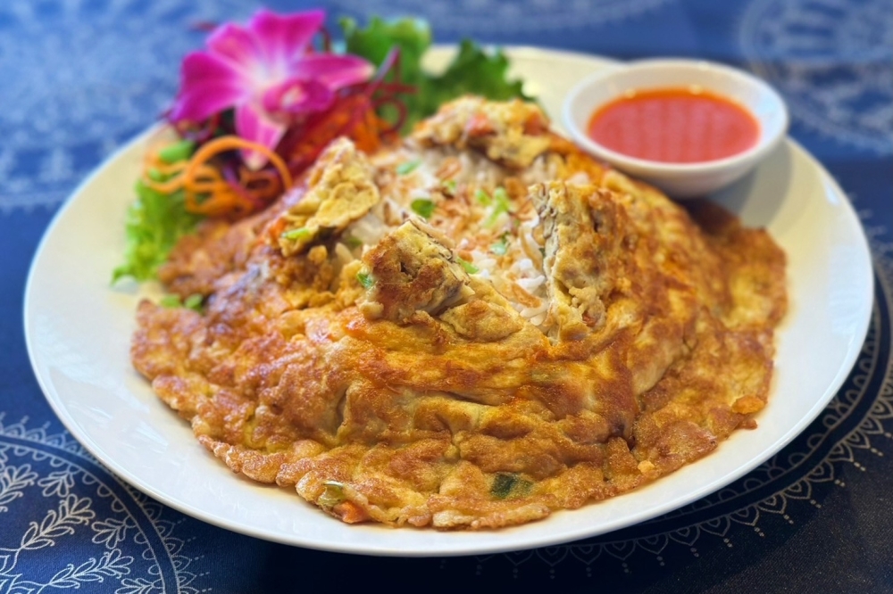 Kai jeow moo sap is a Thai omelet made with ground pork, white onions, carrots and scallions. (Courtesy Absolute Thai Cuisine)