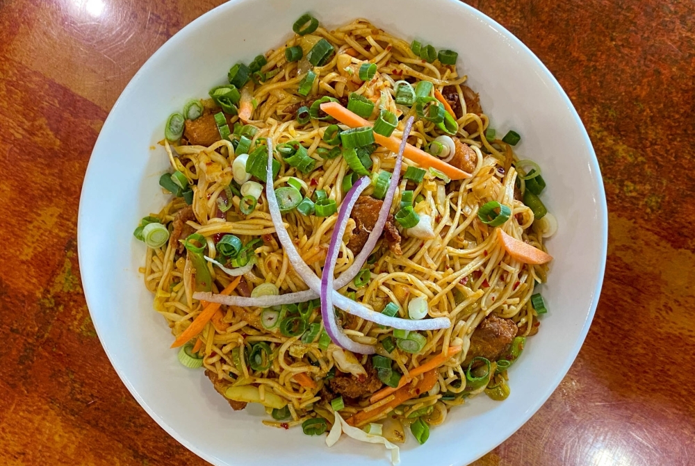 The Indian fusion restaurant offers a menu of soups, kebabs, dosas, naan, fried rice, biryani and noodle dishes, in addition to entrees like chicken tikka masala and shrimp vindaloo. (Courtesy The Monk's Indian Bistro)