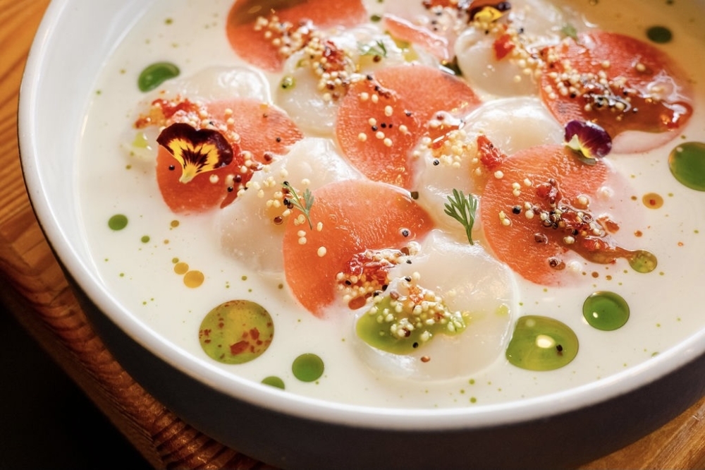 Scallop tiradito is a dish of raw fish, cut in the shape of sashimi, often in a spicy sauce. (Courtesy Atlas Restaurant Group)