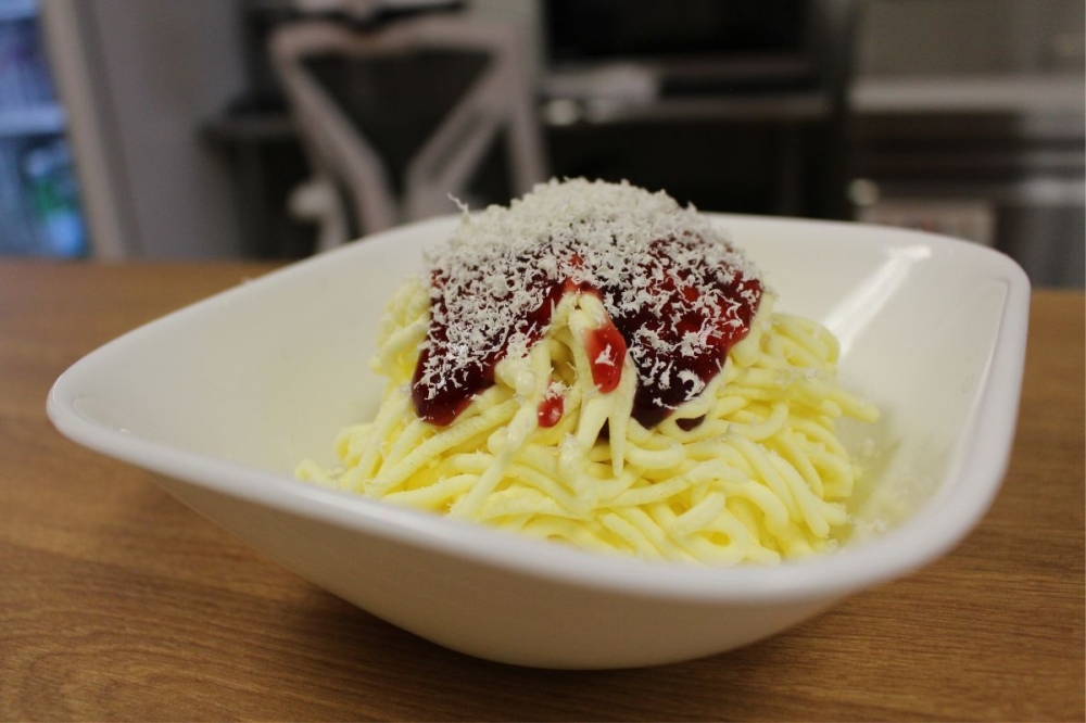 Made to look like a plate of spaghetti, this specialty dessert is made from vanilla-lemon flavored gelato, strawberry syrup and white chocolate shavings. (Asia Armour/Community Impact)