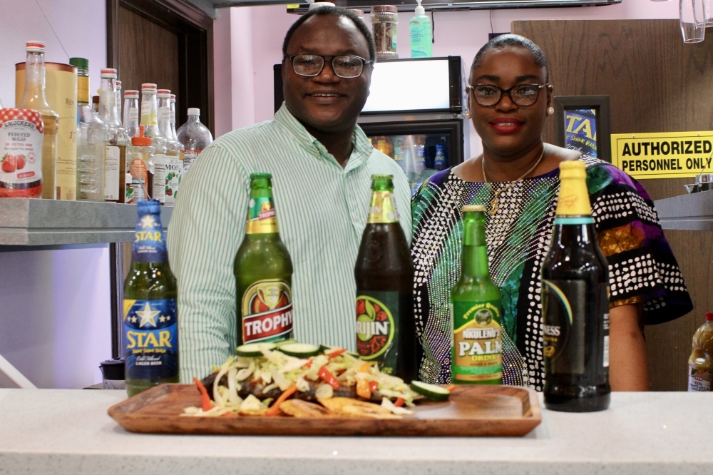 Olatee and Temitayo Thanni-Wright showcase their Nigerian imported beer and grilled tilapia.