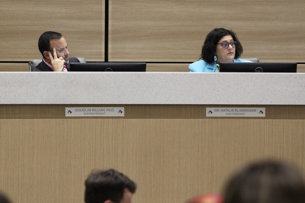 Cy-Fair ISD Superintendent Doug Killian and board trustee Natalie Blasingame listen to speakers at the June 17 board meeting. (Danica Lloyd/Community Impact)