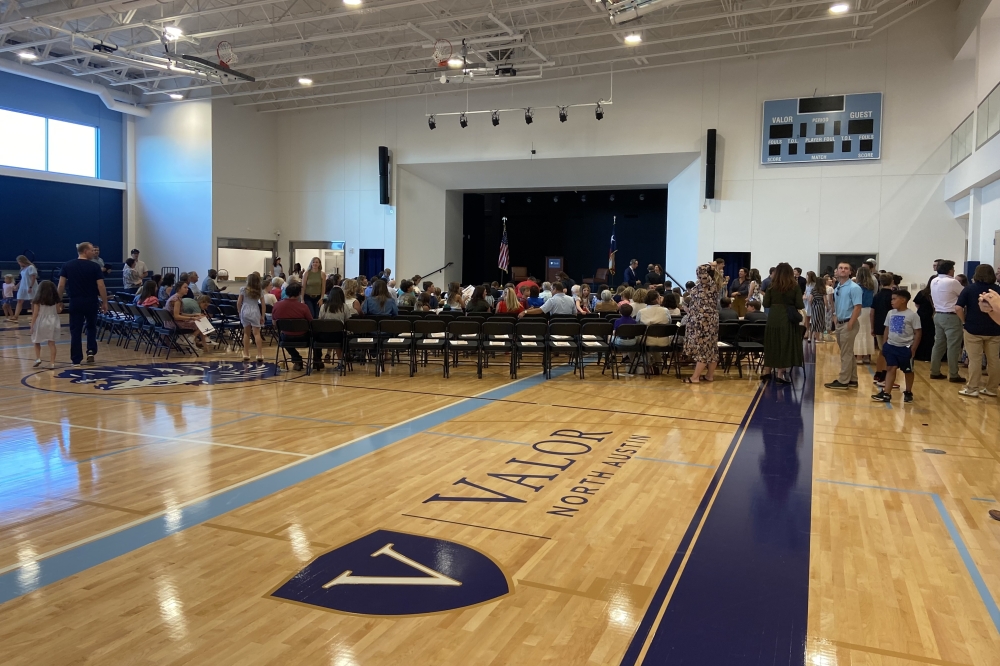 Students, parents and community members gathered to hear remarks for Valor Education officials and tour the new building at a ribbon-cutting ceremony Aug. 6. (Chloe Young/Community Impact)