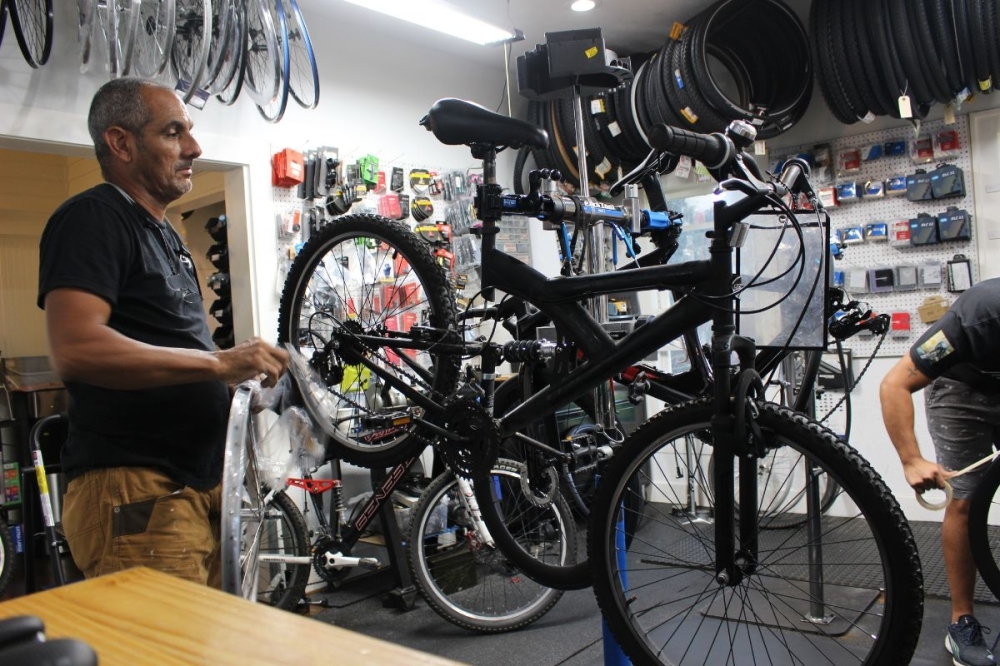 The shop offers tune ups and bike washing services to riders. (Asia Armour/Community Impact)