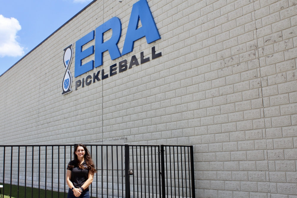 Co-owner Nikki Tejada stands outside her business Era Pickleball. (Jovanna Aguilar/Community Impact)