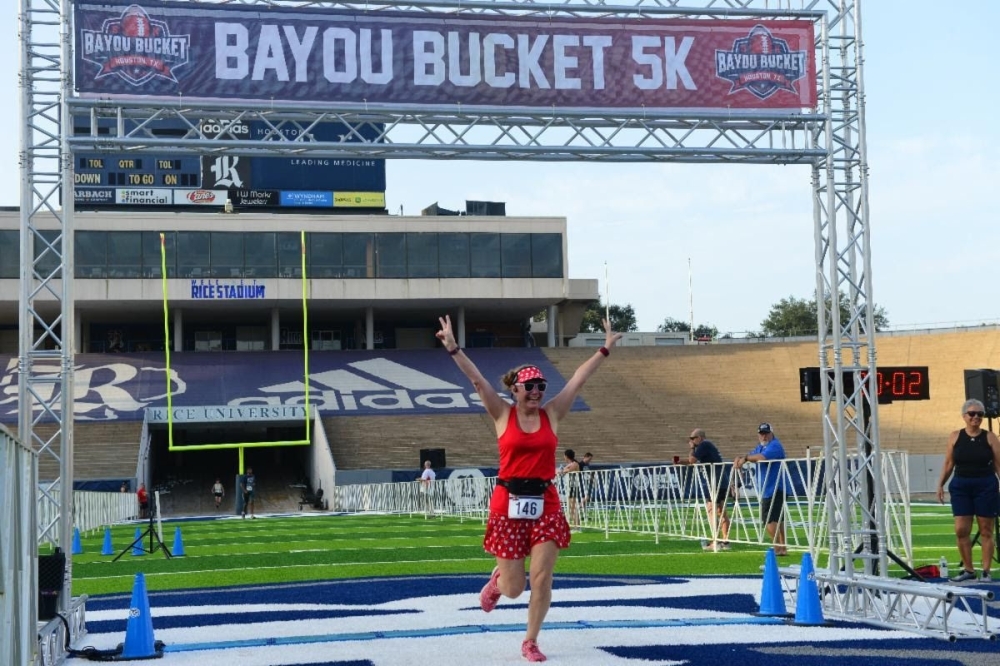 Participants are encouraged to represent their favorite college in a sprint through Rice University at this event. (Courtesy Houston Running Co.)