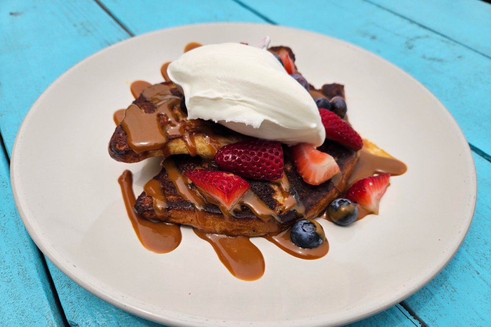 The dulce de leche French toast is dulce de leche, or caramelized milk, whipped cream and fresh berries. (Courtesy Cruzteca)