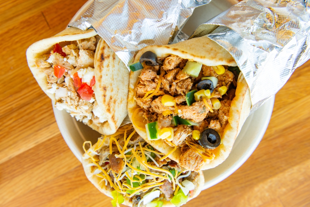 The fast-casual eatery offers customizable New York City-style gyros featuring halal meat, rice bowls, salads, pita sandwiches and loaded fries. (Courtesy Shane Dante Photography)
