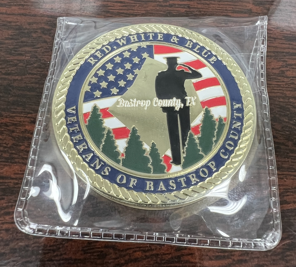 The 20th-anniversary commemorative coins can be purchased for $12 each, or two for $20. (Courtesy Red, White & Blue Veterans of Bastrop County)
