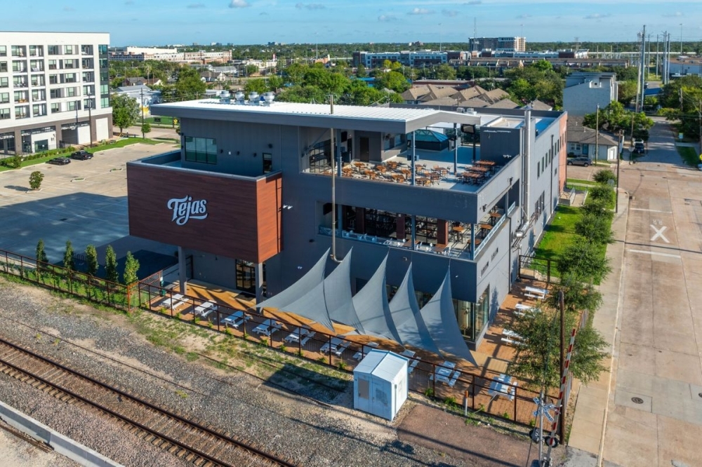 The three-story venue showcase views of downtown Houston. (Courtesy Tejas Brewery and Taproom via Facebook)