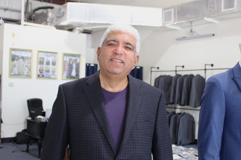 Kam Dadlani owns Kam's Clothiers & Tux Shop. (Sarah Hernandez/Community Impact)