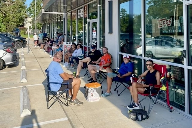 Cardboard Heroes customers camped outside the shop prior to the grand opening event. (Jovanna Aguilar/Community Impact)