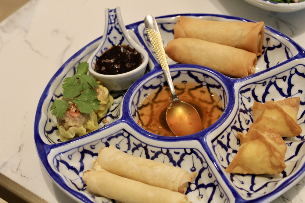 The Woodlands Sampler ($15.99) includes cheese rolls, spring rolls, crab wontons, dumplings and served with house made dipping sauces. (Jovanna Aguilar/Community Impact)