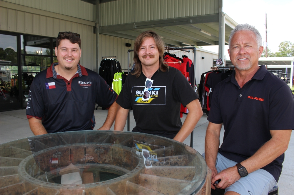 Jason Pennington (far right) runs the business with his wife and two sons. (Asia Armour/Community Impact)