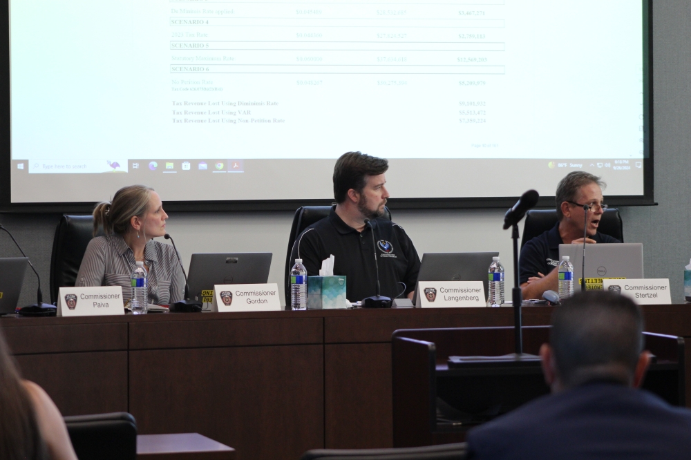 Bevin Gordon, David Langenberg and Kevin Stertzel discuss property tax rates at the Sept. 26 Harris County Emergency Services District No. 9 meeting. (Danica Lloyd/Community Impact)