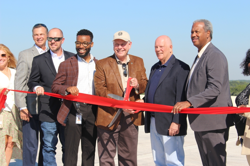 From right: Fort Bend County commissioners Grady Prestage, Andy Meyers, Vincent Morales and Dexter McCoy as well as local transportation officials gathered for the Oct. 2 dedication event. (Kelly Schafler/Community Impact)