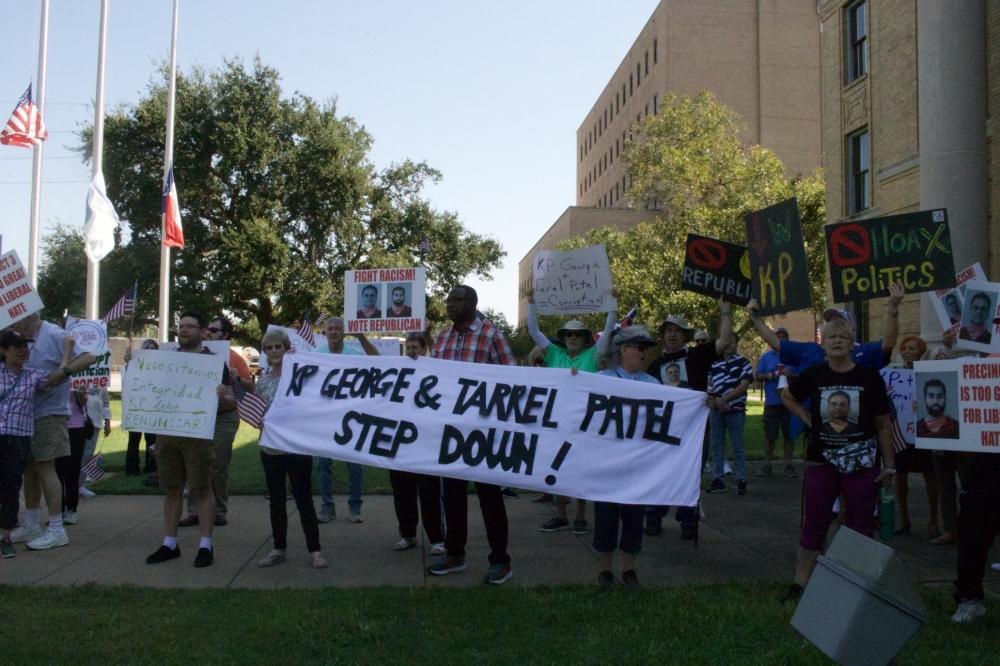 Dozens of protesters gathered outside of the courthouse before the Fort Bend County commissioners meeting on Oct. 8 calling for Fort Bend County KP George to step down. Protesters also called for Taral Patel, the Democratic candidate for Precinct 3 commissioner, to drop out of the election. (Aubrey Vogel/Community Impact)