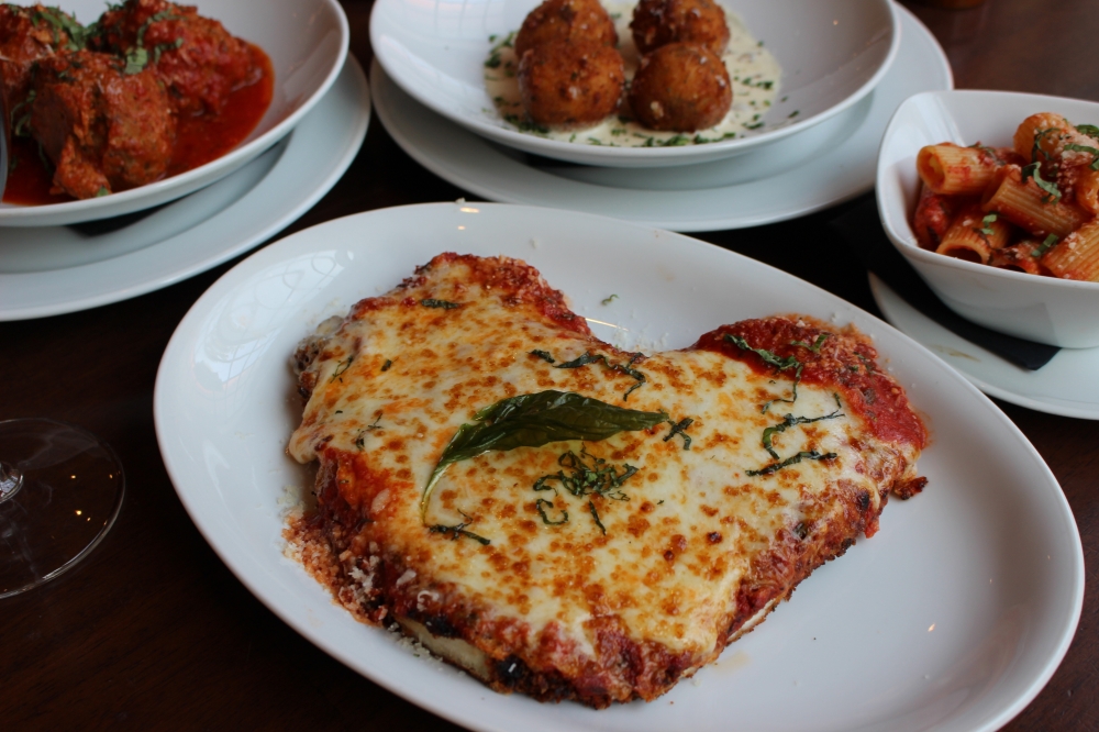 The chicken parmesan ($26) features breaded chicken, mozzarella and pomodoro. (Asia Armour/Community Impact)