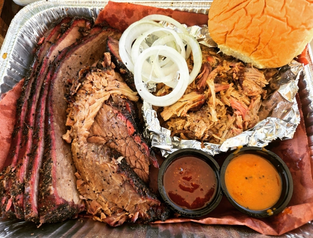 A popular menu item at Bubby's BBQ is called the Holy Trinity, and features brisket, pulled pork, and smoked chicken. (Courtesy Bubby's BBQ)