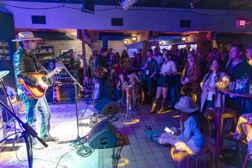 Local musician Calder Allen (left) and singer-songwriter Charlie Sexton perform to a private audience inside Arlyn Studios at its 40th birthday party. (Courtesy @GaryMillerShoots)