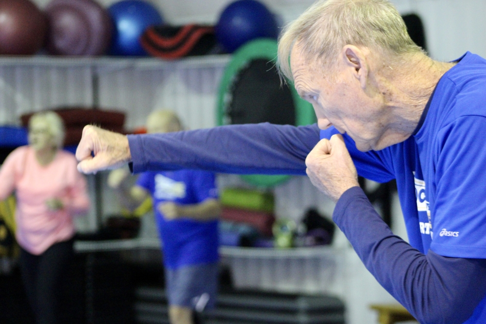 A Rock Steady boxer practices a punch during a class on Dec. 2. Rock Steady Boxing is a non-contact program that helps people with Parkinson's fight the disease. (Danica Lloyd/Community Impact)